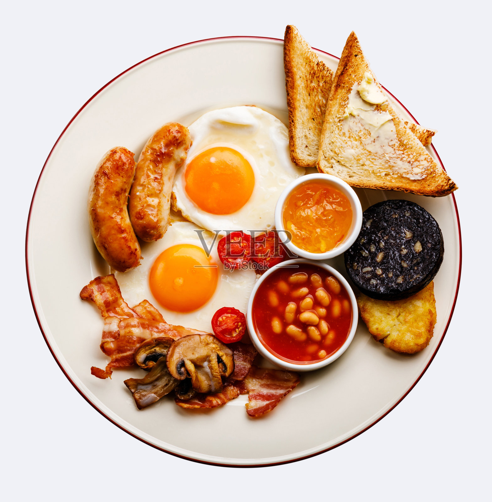 全煎英式早餐，有煎蛋，香肠，熏肉，血肠，豆类和吐司照片摄影图片