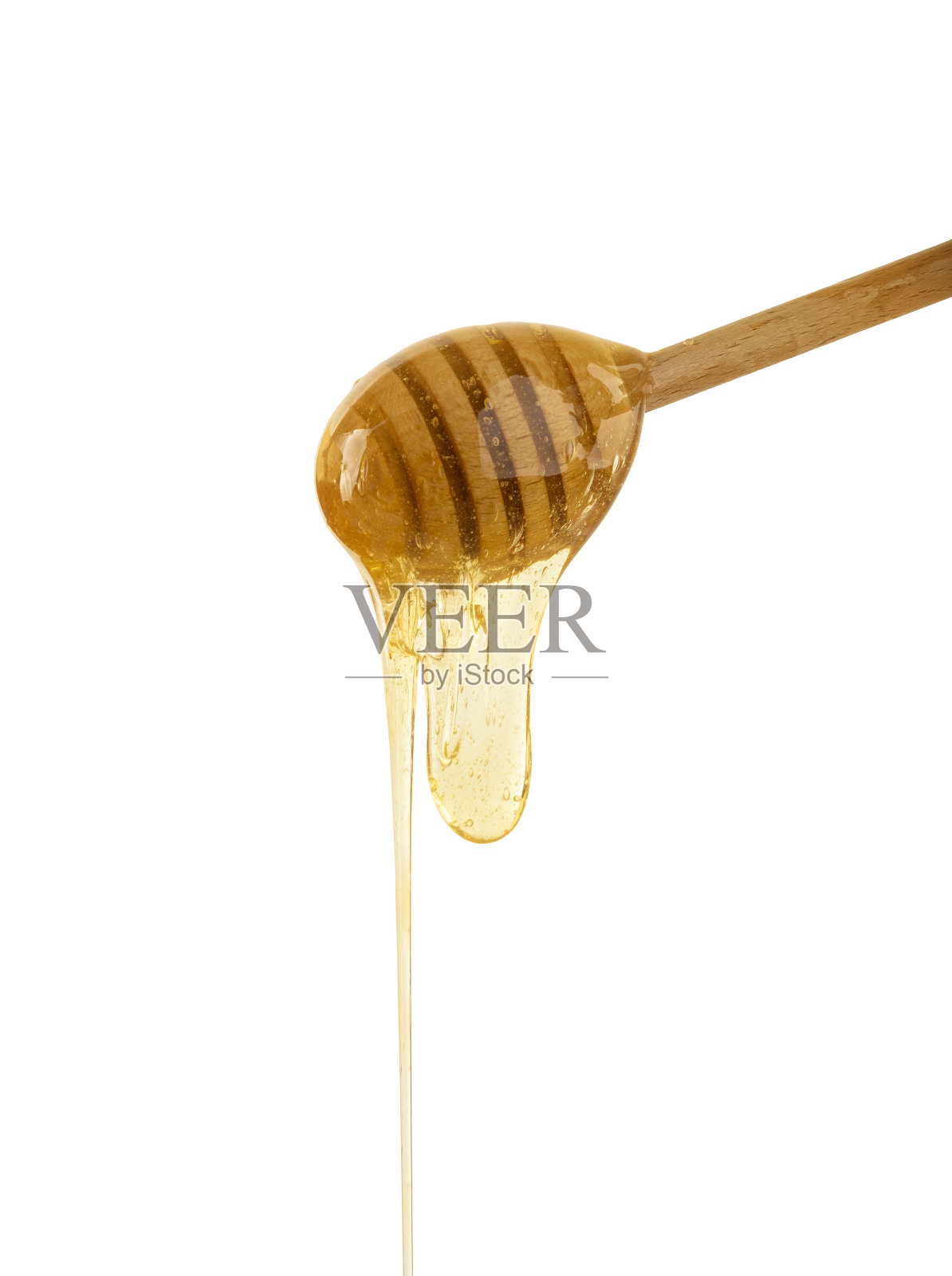 近距离蜂蜜从木勺上流动白色照片摄影图片
