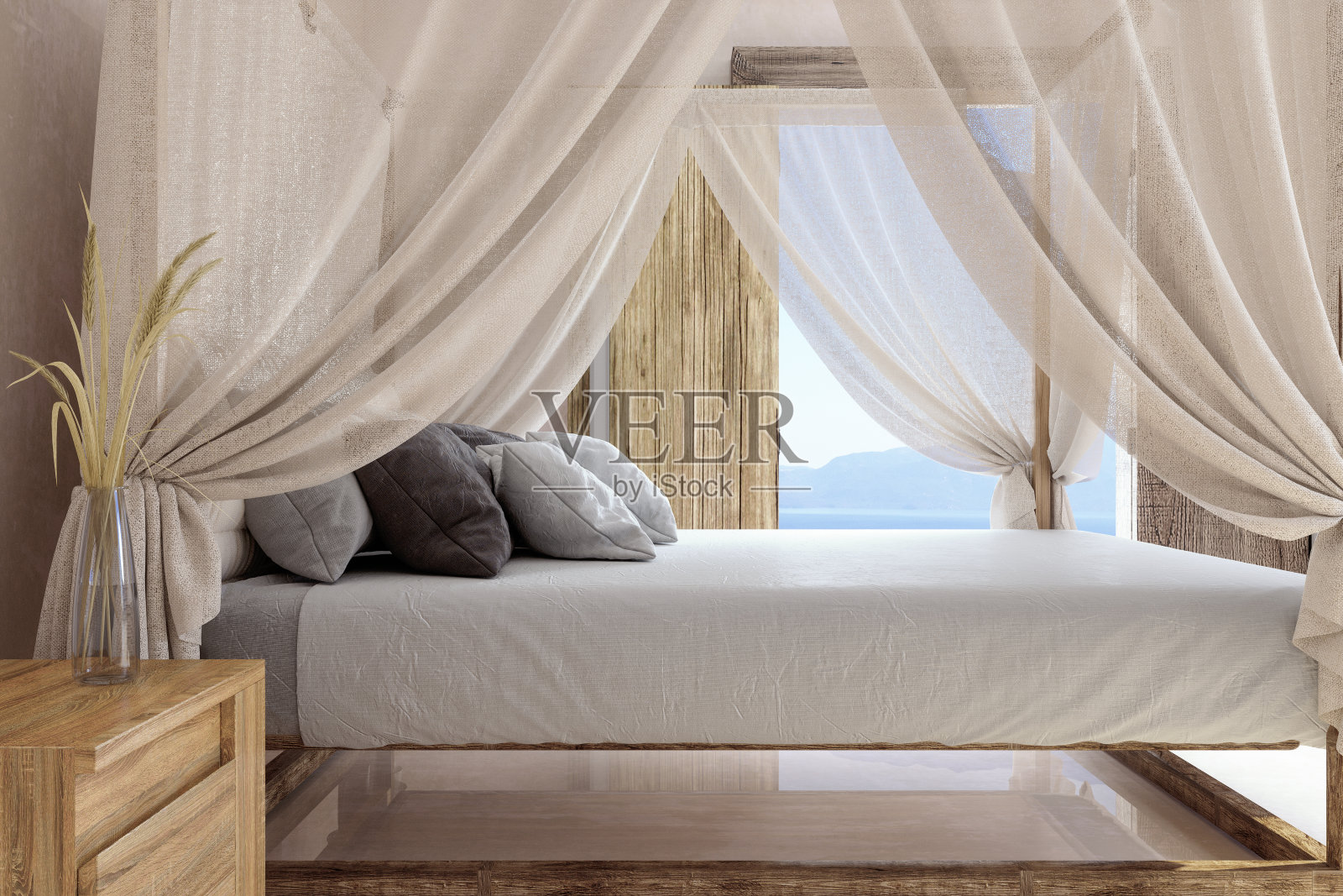 带有蚊帐和海景背景的酒店床的侧视图。照片摄影图片