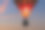 日落时乘坐热气球素材图片