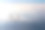 飞机飞越云和阿尔卑斯山上的夕阳。前面素材图片