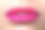 近距离观看美丽的女人的嘴唇与粉红色的口红素材图片