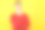 年轻英俊的男人的肖像在红色毛衣拿着他的手靠近下巴思考在黄色的背景素材图片